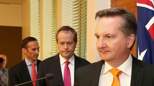 Shadow assistant treasurer, Andrew Leigh, Opposition Leader Bill Shorten and shadow treasurer Chris Bowen address the media at Parliament House on Monday.