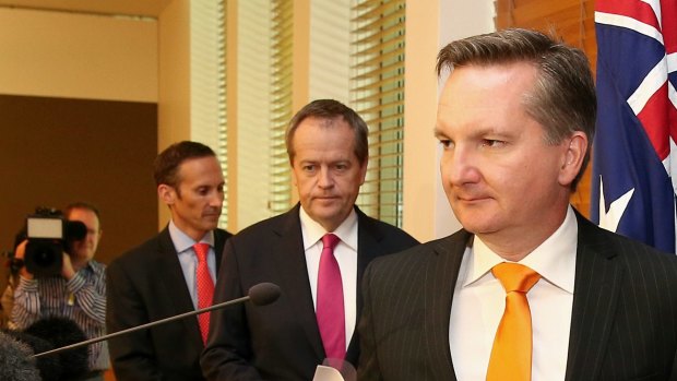 Shadow assistant treasurer, Andrew Leigh, Opposition Leader Bill Shorten and shadow treasurer Chris Bowen address the media at Parliament House on Monday.