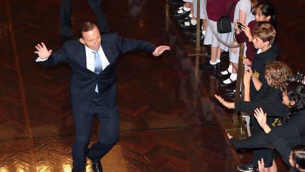 Prime Minister Tony Abbott gives an enthusiastic welcome to school children in the Great Hall. Photo: Alex Ellinghausen