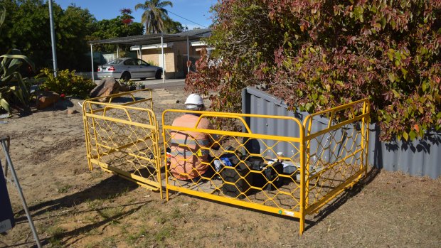 A technician installs NBN in front of a home in Wanneroo.