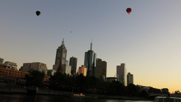 ...Balloons over the city skyline of Melbourne. 