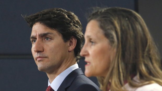 "Totally unacceptable": Canadian Prime Minister Justin Trudeau, left, and Canadian Foreign Affairs Minister Chrystia Freeland hold a news conference in Ottawa on Thursday. 