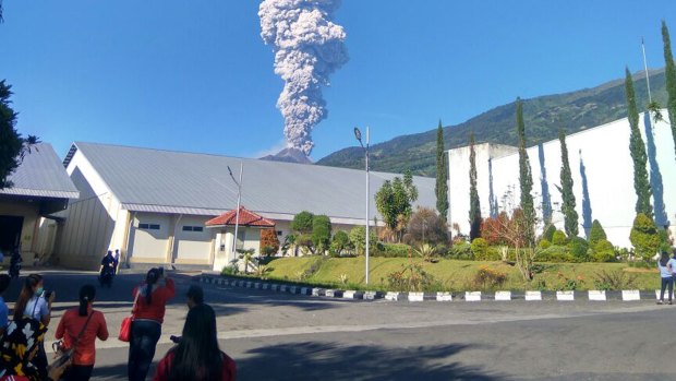 Mount Merapi spews volcanic materials from its crater as seen from Klaten, Central Java, on Friday.