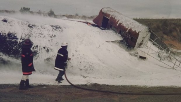 Fire fighters using toxic foam to put out a blaze during a training drill at Melbourne's Tullamarine Airport in 1998. 