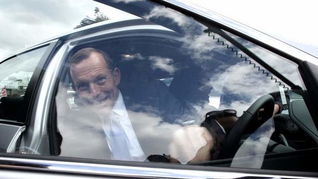 Opposition leader Tony Abbott visits a car  dealership in Victoria on Friday.