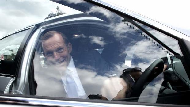 Opposition leader Tony Abbott visits a car  dealership in Victoria on Friday.