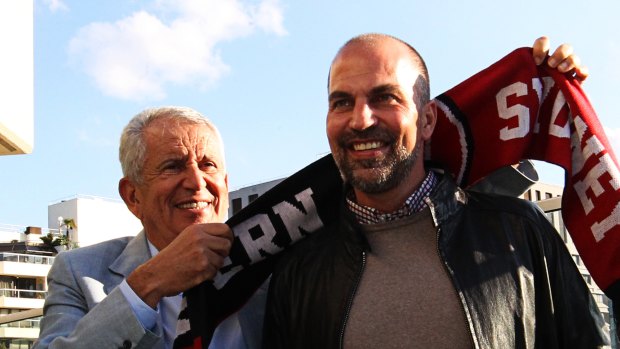 Welcome: Western Sydney Wanderers chairman Paul Lederer gives Markus Babbel a club scarf.