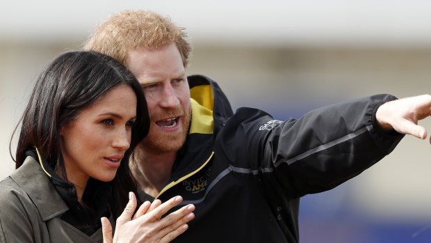 Britain's Prince Harry and his fiancee Meghan Markle attend the UK team trials for the Invictus Games in Sydney at the University of Bath in Bath, England.