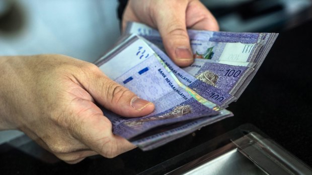 Fears of US interest rate rises have hit EM currencies such as the Malaysian ringgit hard.