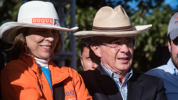 Alvaro Uribe, former president of Colombia, right, attends the closing campaign rally of Ivan Duque.