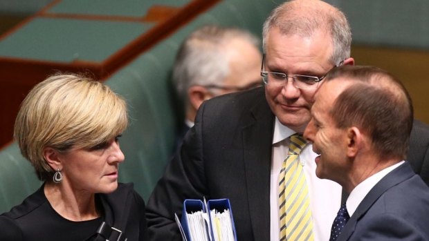 Prime Minister Tony Abbott departs question time with Julie Bishop and Scott Morrison on Wednesday.