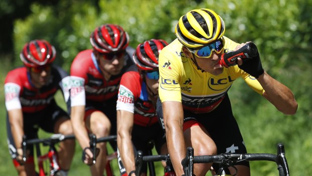 Belgium's Greg van Avermaet dons the yellow jersey during stage five.