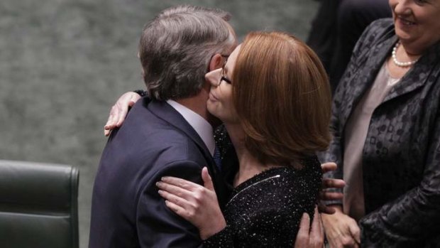 Prime Minister Julia Gillard embraces Treasurer Wayne Swan after he delivered his 2013 budget