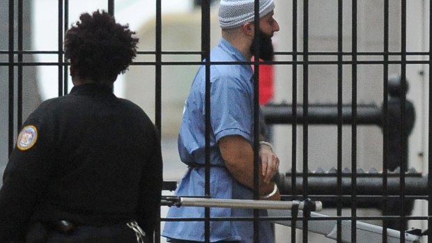 Adnan Syed walks into the court in Baltimore before a hearing in 2017. 
