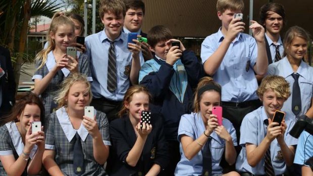 Students watch Labor leader Kevin Rudd during his visit to St Columban's College in Caboolture on Monday.