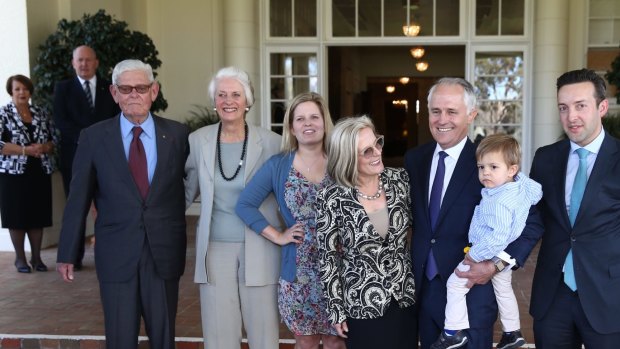 Tom Hughes (left) with Prime Minister Malcolm Turnbull and his family at Government House following his swearing in on Tuesday.