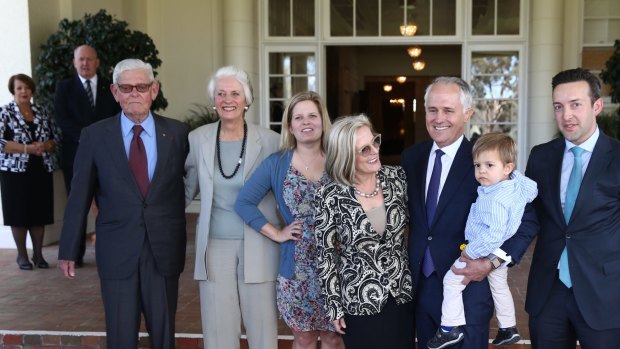 Tom Hughes (left) with Prime Minister Malcolm Turnbull and his family at Government House following his swearing in on Tuesday.