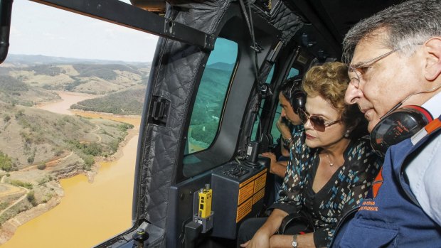 Then Brazilian president Dilma Rousseff inspects the environmental damage to the Vale River after the Samarco disaster.