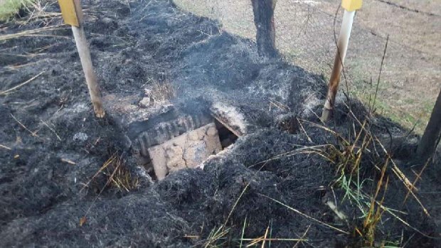 Fire damage at the Telstra cable pit east of Orange.