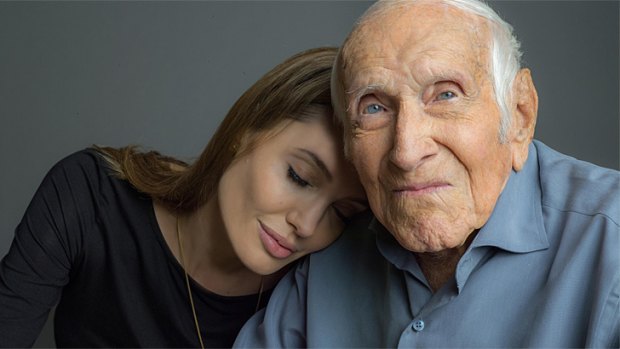 <i>Unbroken</i> director Angelina Jolie and Louie Zamperini, 96, an American hero whose story has taken 50 years to be told.