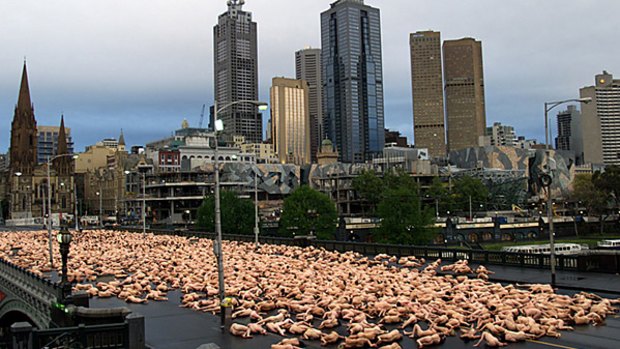 Photographer Spencer Tunick photographs a massive landscape of human bodies in Melbourne in 2007.