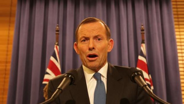 Opposition Leader Tony Abbott addresses the media late on Wednesday night.