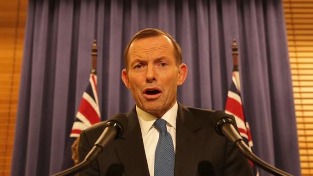 Opposition Leader Tony Abbott addresses the media late on Wednesday night.