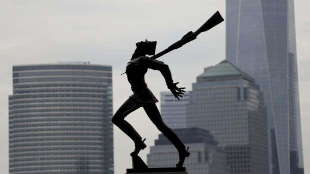 Buildings in Lower Manhattan provide a backdrop to a statue dedicated to the victims of the Katyn massacre of 1940, in Jersey City, New Jersey. 