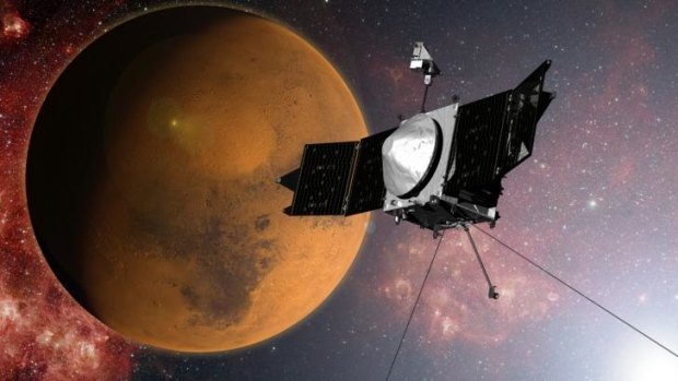 An artist's concept provided by NASA of the MAVEN spacecraft as it approaches Mars.