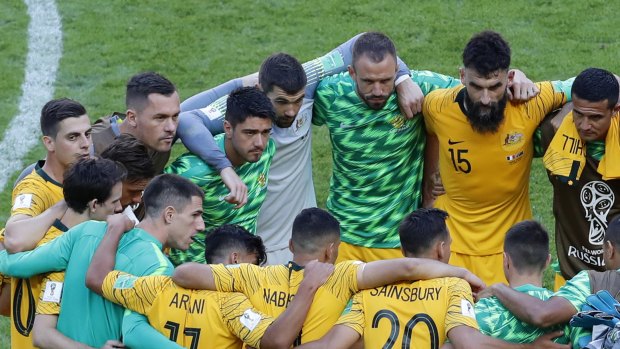Mile Jedinak addresses the players after the reverse against France. The Socceroos skipper knows the team can't feel sorry for itself.