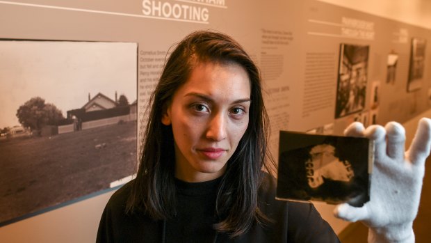 Curator Amber Evangelista at Victoria Police museum's new exhibition 'The dark room: photographs and stories from Victoria's 1930s crime scenes'.