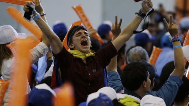 Supporters of Ivan Duque, presidential candidate for the Democratic Centre, celebrate finishing first in the first round, in Bogota.