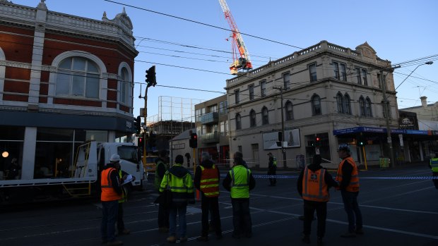 Wild winds overnight affected the structural integrity of a construction crane, forcing residents to evacuate and authorities to close Bridge Road.