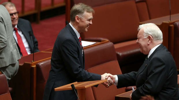 Senator Chris Ketter is congratulated by Senator Joe Bullock after delivering his first speech in the Senate. Photo: Alex Ellinghausen