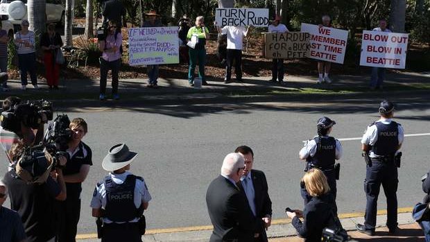 Protestors gather before the arrival of Kevin Rudd and Peter Beattie in Beenleigh on Thursday.