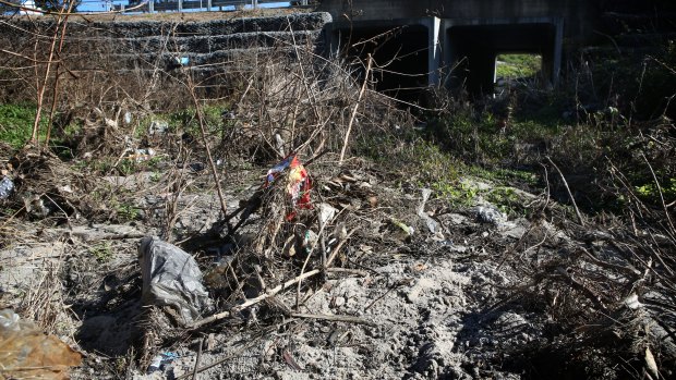 Disposable ''one-use'' plastic shopping bags litter a storm water way at Yarra Bay in Sydney. Supermarket giants Woolworths and Coles will both phase out the bags nationally by July 1. 