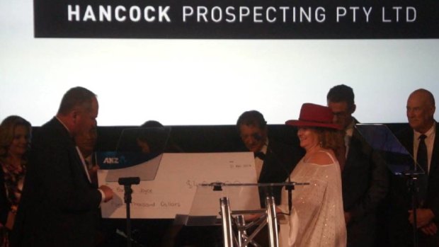 Former deputy prime minister and agriculture and water resources minister Barnaby Joyce receives a $40,000 cheque from mining and agricultural magnate Gina Rinehart