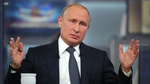 Russian President Vladimir Putin answers a question during his annual call-in show in Moscow.