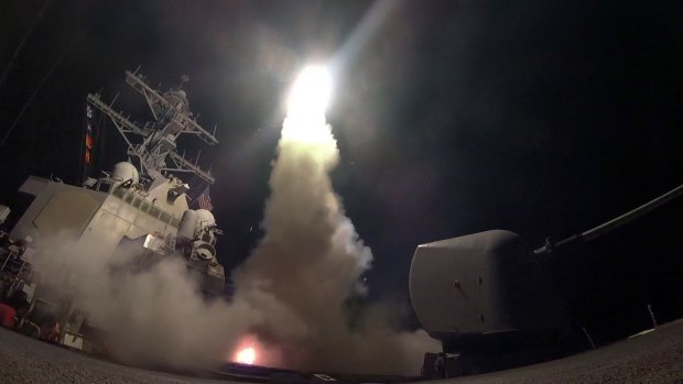 The guided missile destroyer USS Porter launches a Tomahawk missile as the US blasted a Syrian air base with a barrage of cruise missiles.