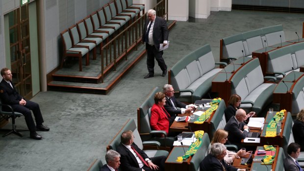 Palmer United Party leader Clive Palmer leaves question time at 2.55 pm on Thursday.