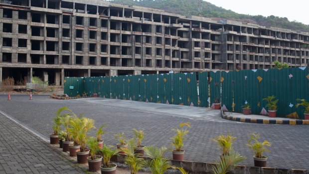 Partially constructed buildings lay empty in Lavasa, India.