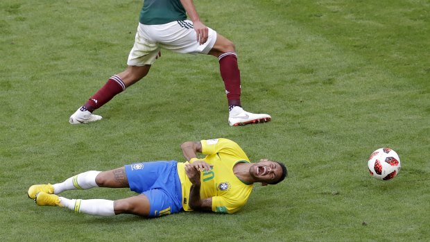 Too easy: Brazilian star Neymar hits the deck.