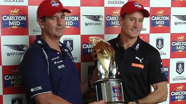 Ross Lyon and John Worsfold pose with the trophy ahead of the 38th western derby.