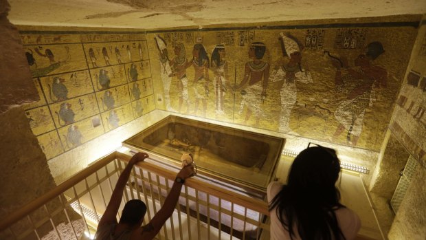 Tourists look at the tomb of King Tut in Valley of the Kings in Luxor, Egypt. .