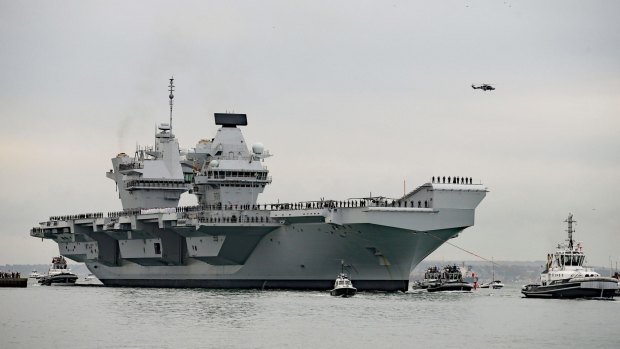 The HMS Queen Elizabeth, the British navy's newest and most expensive aircraft carrier, will be accompanied by Australian navy ships through the South China Sea.