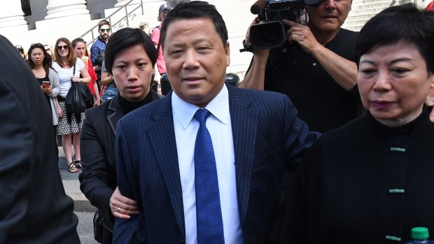 Billionaire Ng Lap Seng, centre, exits the federal court in New York on Friday.