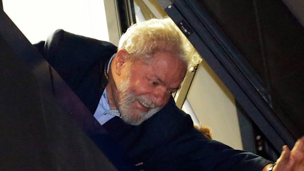 Brazil's former President Luiz Inacio Lula da Silva waves to supporters in front of the metal workers union headquarters in Sao Bernardo do Campo, Brazil.