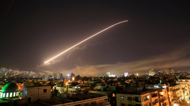 The Damascus sky lights up missile fire as the US or France or the UK launches an attack on Syria targeting different parts of the capital in April 14.