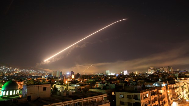 The Damascus sky lights up missile fire as the US or France or the UK launches an attack on Syria targeting different parts of the capital in April 14.