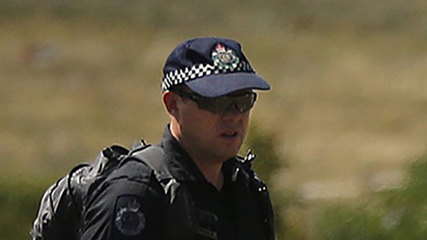 Australian Federal Police and their dutch counterparts search the MH17 crash site for human remains in 2014.